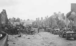 3rd Armored Division waiting to advance in St. Lo, Normandy, France.