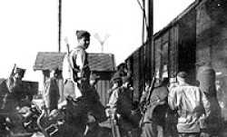 Men of Company C, 101st Infantry, preparing to board a train on leaving Austria for France in 1945.