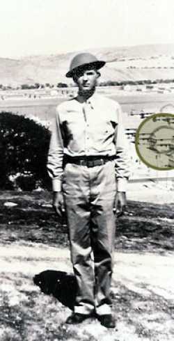 Basic training in California. Late summer 1942. We still had the World War I helmets at that time. The circle in the picture was my barracks.