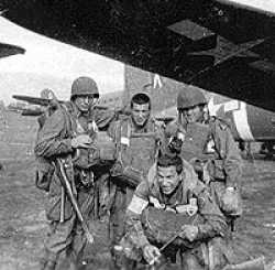 Walt with his friends in front of his plane.