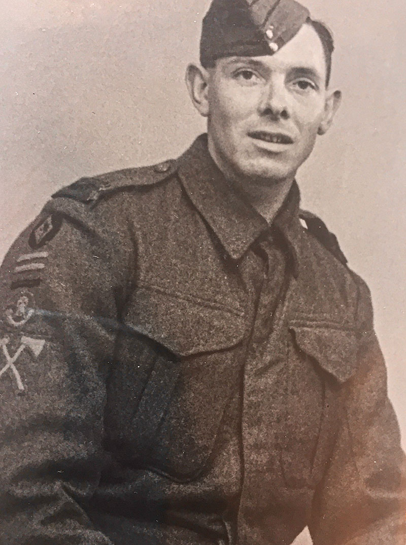 Sidney John Bruton in uniform. Notice the 48th (South Midland) Divisional insignia on his arm together with a cloth KSLI badge and a Pioneer Corps Trade badge
