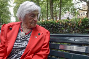 Lotty seated on the bench in the Apollolaan, Amsterdam