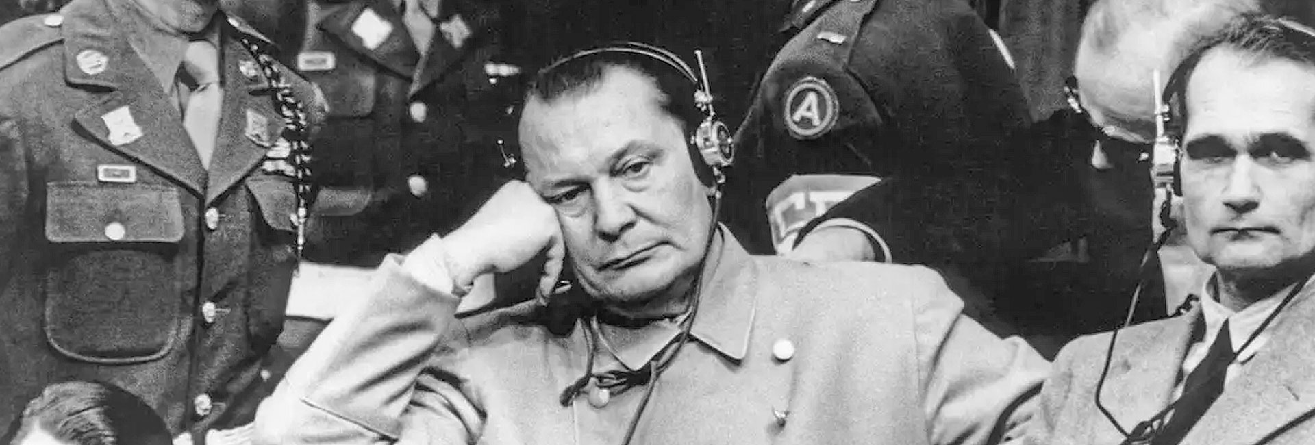 Hermann Göring and Rudolf Hess listening to the proceedings. The initial attitude of the defendants was one of arrogance and annoyance, treating the tribunal as a temporary inconvenience they could outsmart or escape.